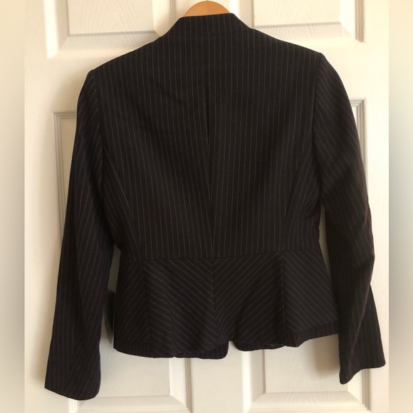 A peplum style blazer. It’s a unique look which I wished I had bought a size up. - Picture 4 of 4